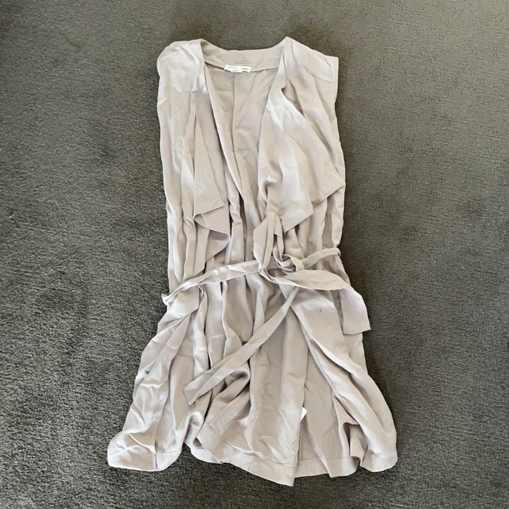 Sleeveless belted duster coat